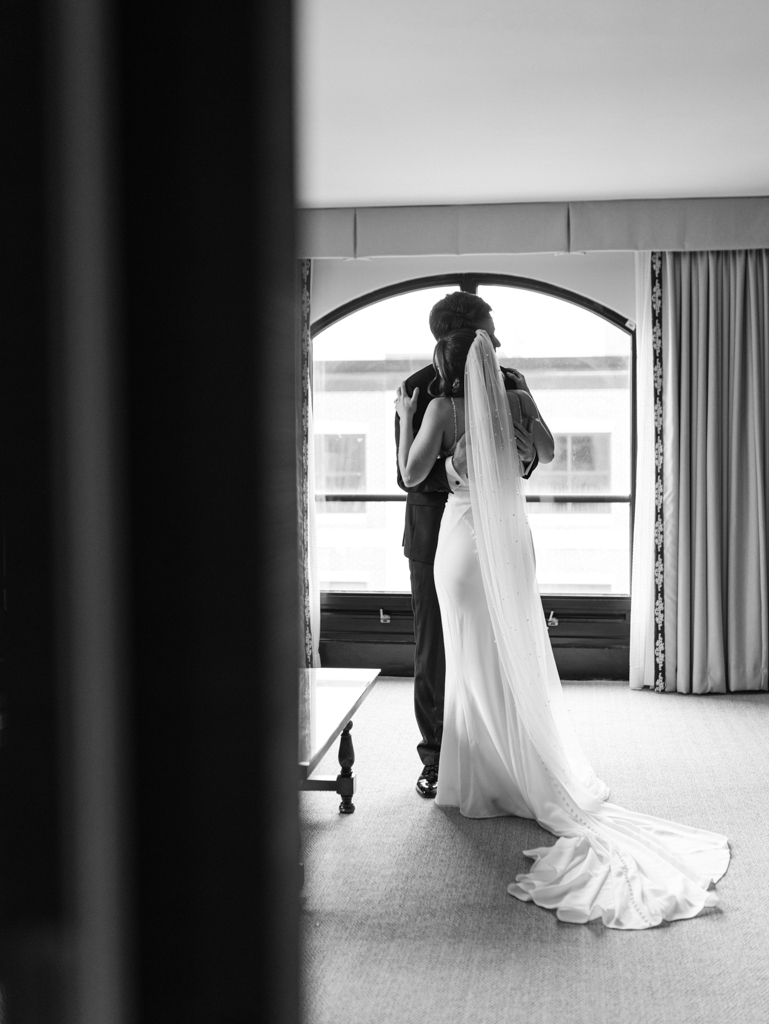 Bride and groom hugging during their first look at the Graduate Hotel Annapolis