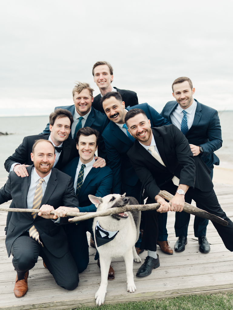 groomsmen and groom's dog on his wedding day