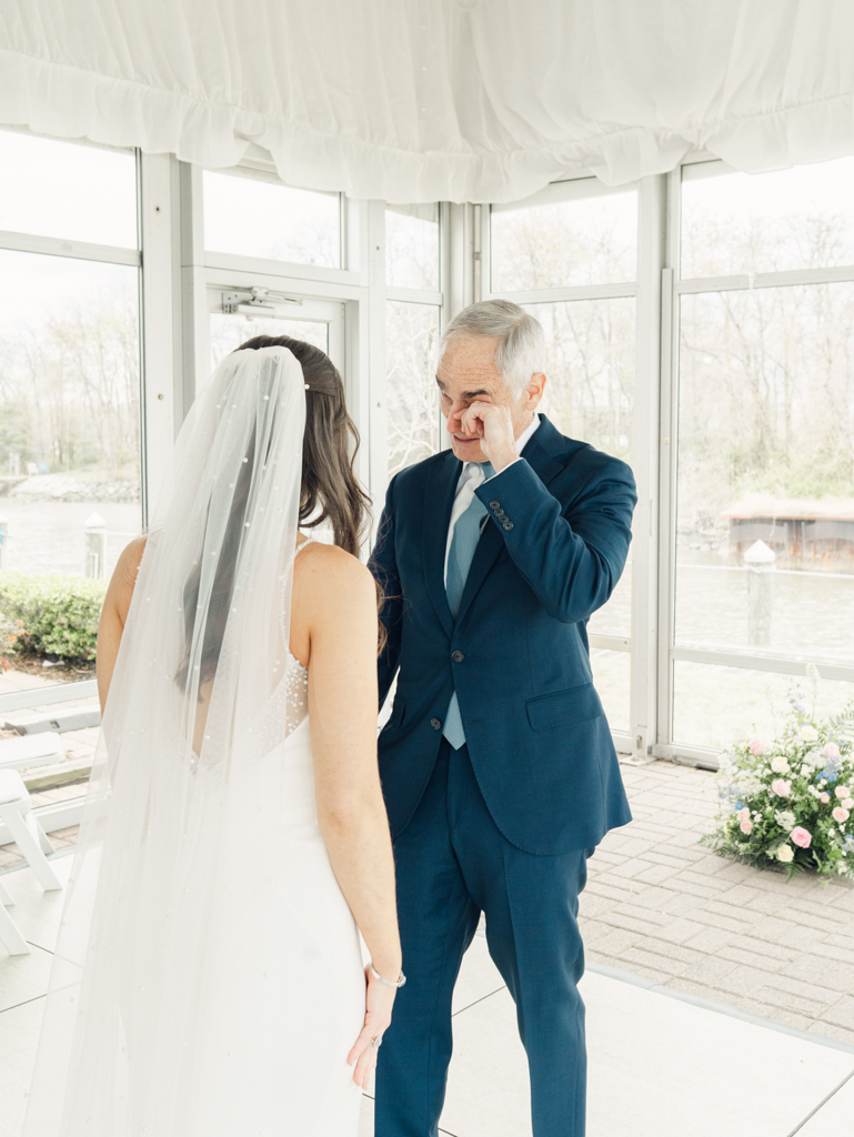 dad tearing up during the informal first look with his daughter prior to her wedding ceremony at Silver Swan Bayside