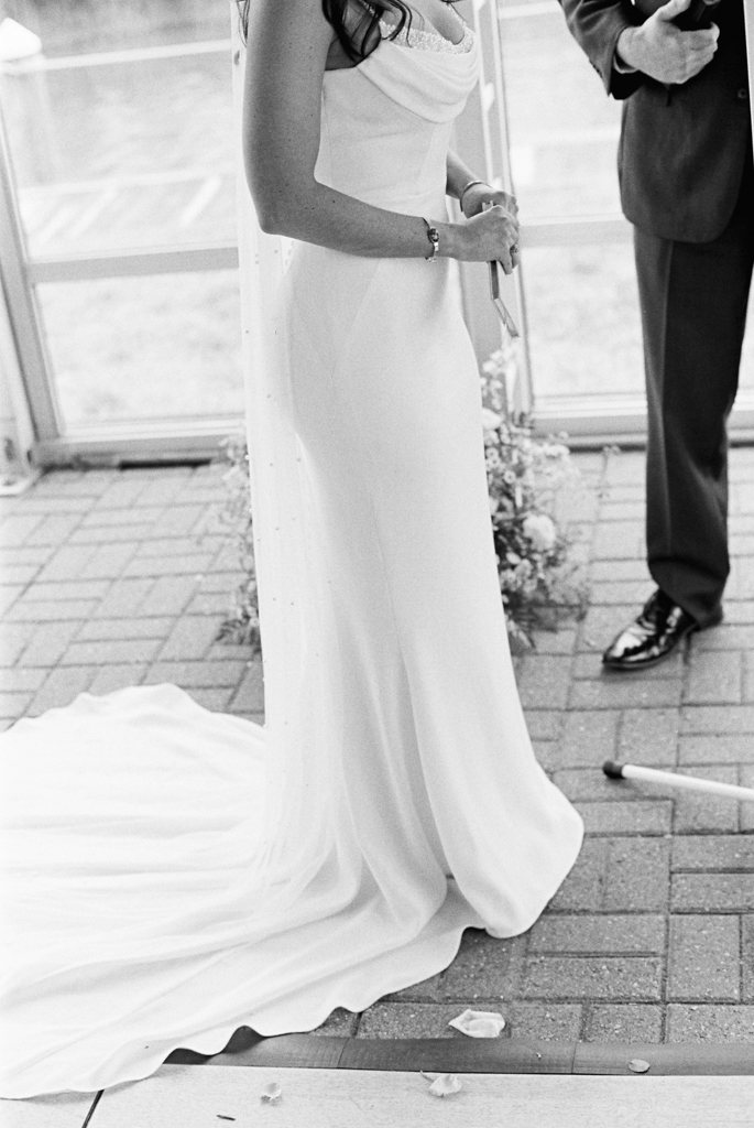 bride holding vow book during wedding ceremony taken by film wedding photographer