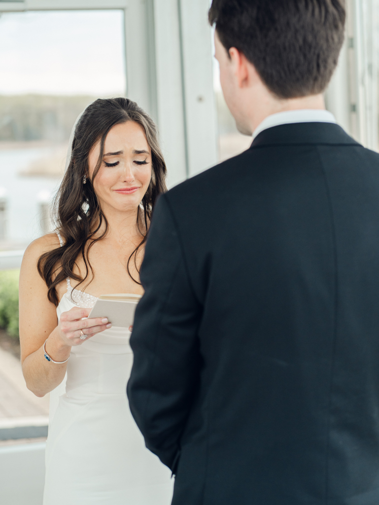bride crying while giving her vows during her wedding ceremony taken by film wedding photographer