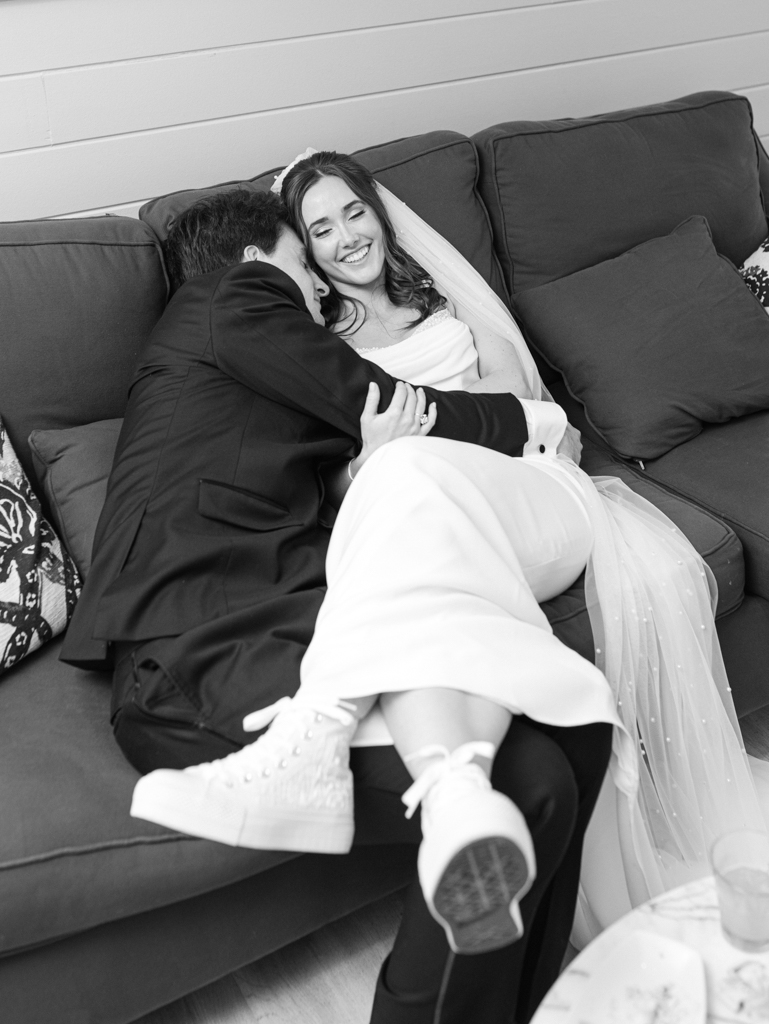 Bride and groom taking a moment in the bridal suite at Silver Swan bayside on their wedding day taken by film wedding photographer