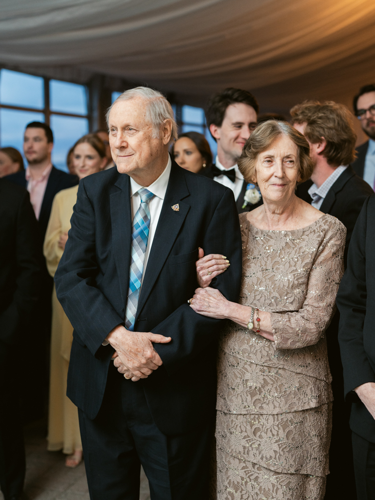 groom's grandparents watching during parent dances on their grandson's wedding day