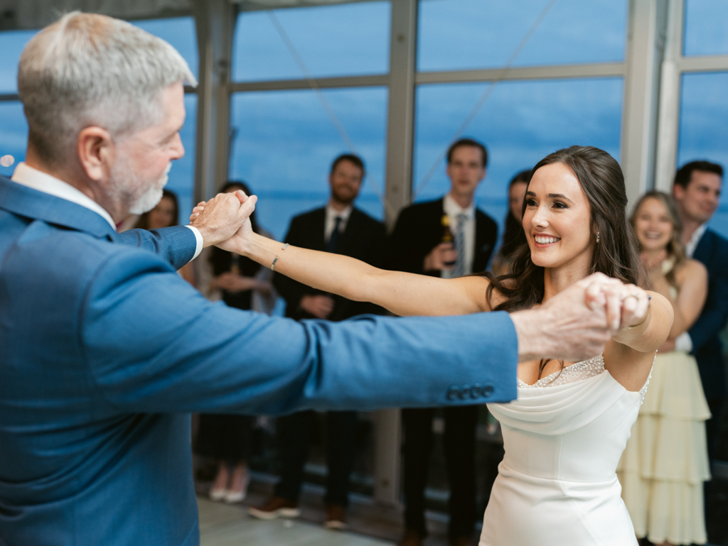 bride dancing with her step dad on her wedding day