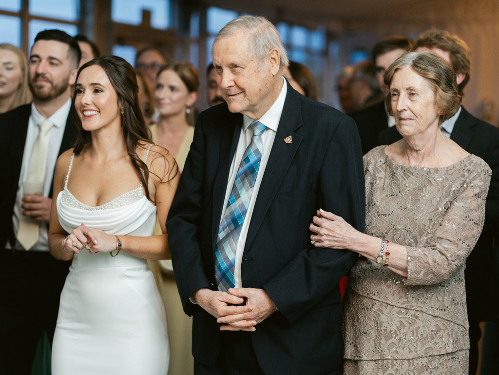 bride and groom's grandparents watching on during the mother-son dance on his wedding day