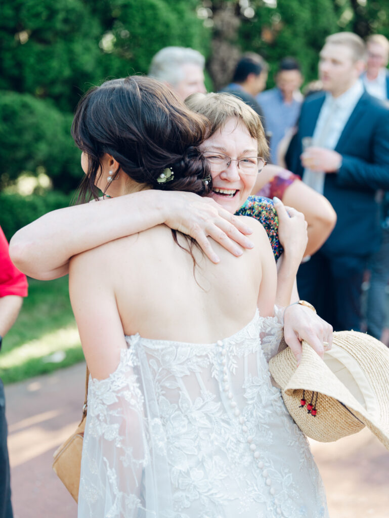 Guests enjoying cocktail hour outside at Swan Harbor Farm on the Bride and Groom's wedding day by a Baltimore, MD documentary style wedding photographer