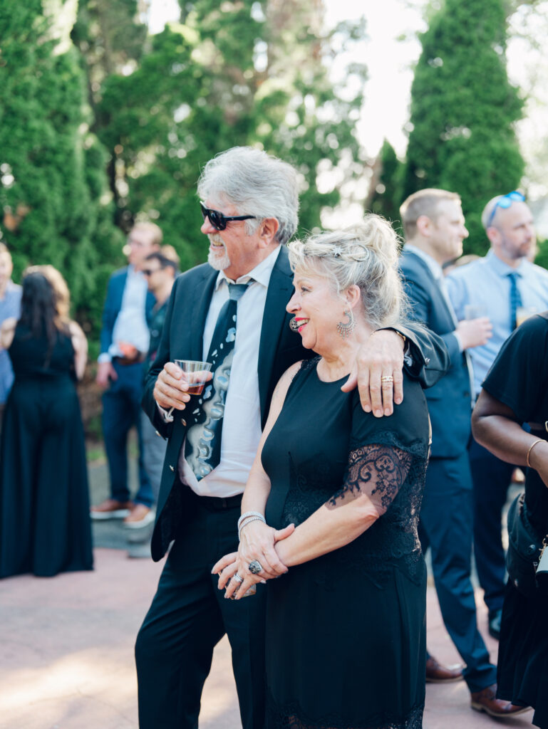 Guests enjoying cocktail hour outside at Swan Harbor Farm on the Bride and Groom's wedding day by a Baltimore, MD documentary style wedding photographer