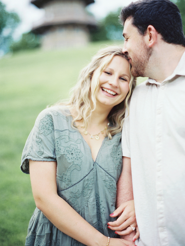 girl laughing during her engagement photos in Patterson Park by Baltimore film wedding photographer