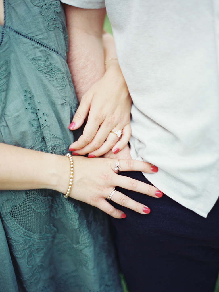 girl's hands featuring engagement ring by Baltimore film wedding photographer