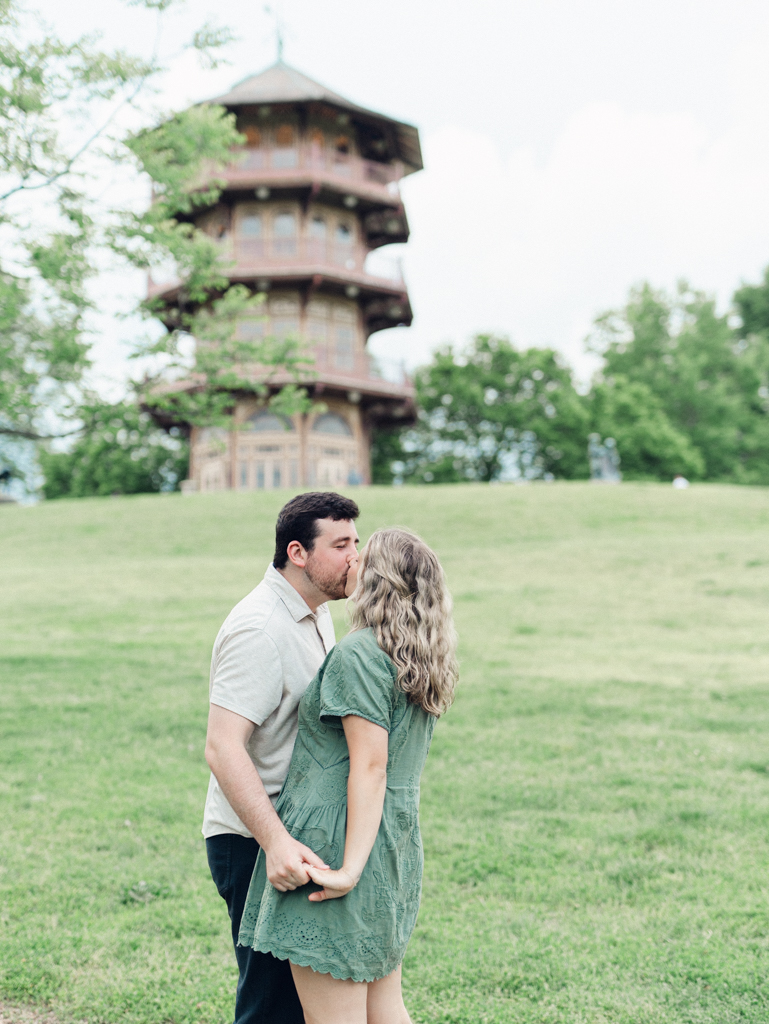 couple kissing in Patterson Park by Baltimore wedding photographer