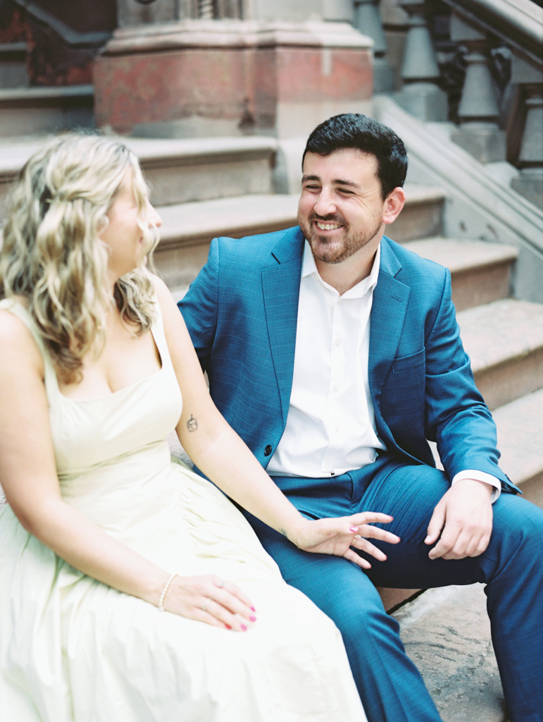 couple sitting on steps together in Mount Vernon Baltimore by Baltimore film wedding photographer