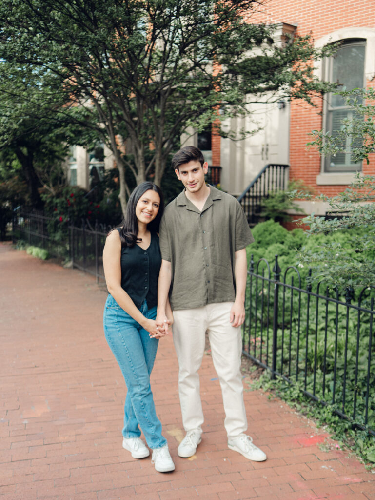 couple standing together smiling at the camera by dc film wedding photographer