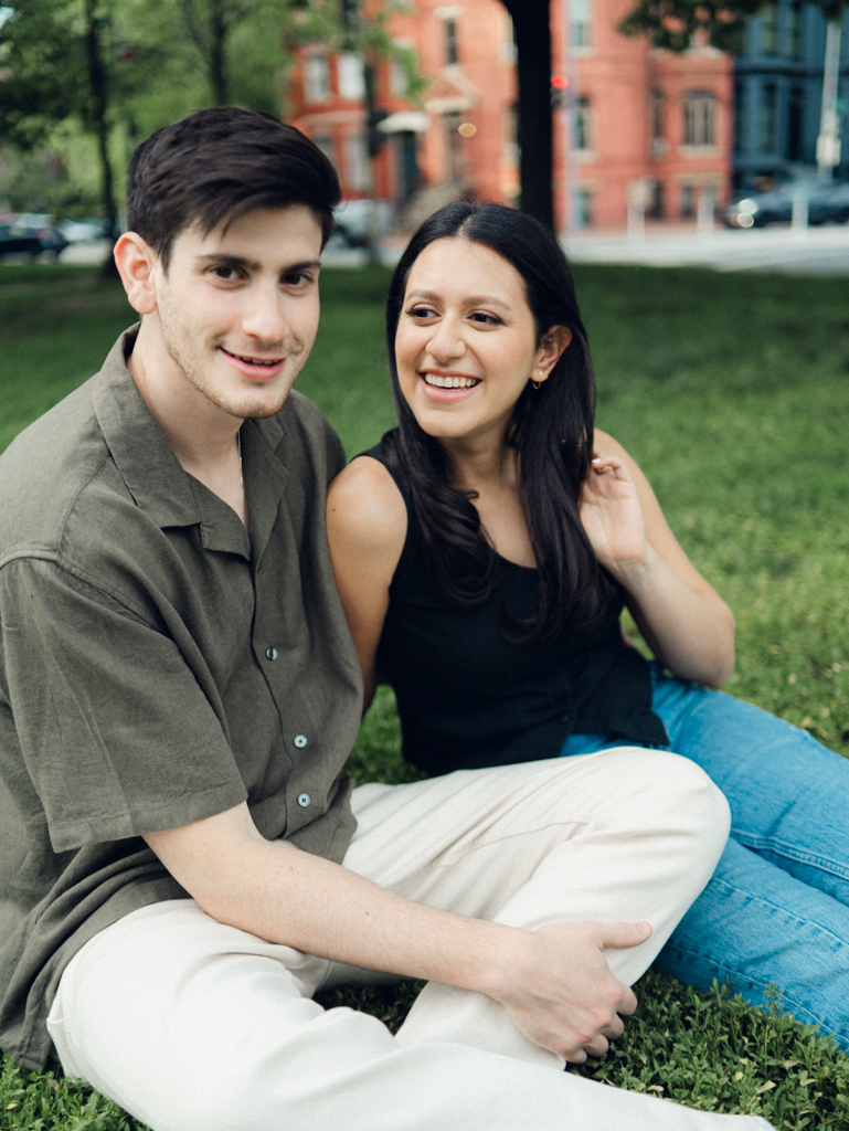 couple sitting together in Logan circle during their engagement session by dc film wedding photographer