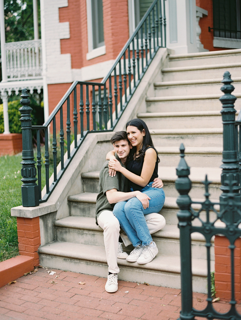 couple sitting laughing together by dc film wedding photographer