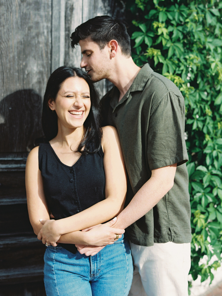 girl smiling during her engagement session in Blagden alley by dc film wedding photographer